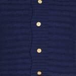 Close up of navy blue knit cushion with buttons