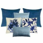 A set of chic blues and off-whites cushion covers white flower prints