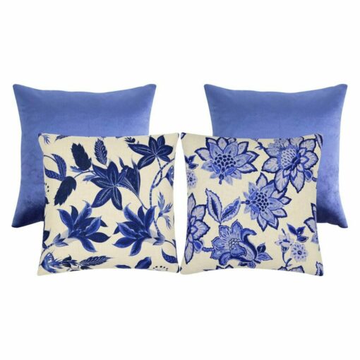 A set of blue and white floral cushion covers made of velvet and linen fabric
