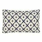 Image of white rectangular cushion with navy blue lattice design