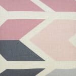 Close up image of pink and grey square cushion cover with arrow design