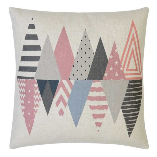 Photo of white cushion cover with pink and grey triangles