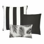 An image of a striped black and white outdoor cushion, a plain black outdoor cushion and a single black and white rectangular botanical design outdoor cushion.
