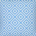 A close up of a bold geometric blue print on a water resistant outdoor cushion cover.