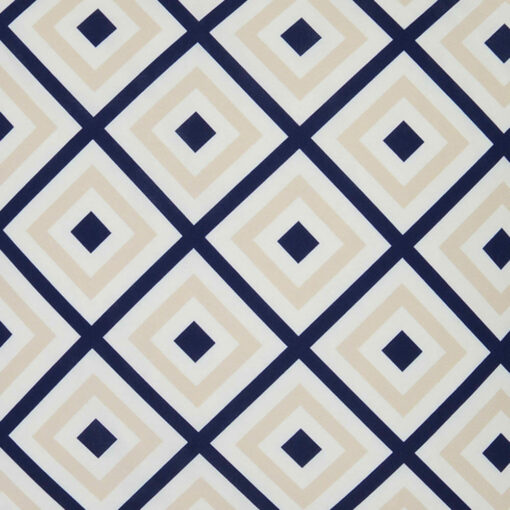 A close up of a bold geometric beige and navy print on a water resistant outdoor cushion cover.