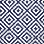A close up of a bold geometric navy print on a water resistant outdoor cushion cover.