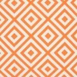 A close up of a bold geometric orange print on a water resistant outdoor cushion cover.