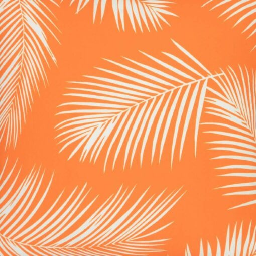 A close up view of a water resistant orange outdoor cushion cover that has a beautiful palm tree leaf print.