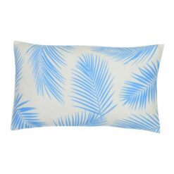 A lovely outdoor cushion with palm tree blue print on a white background.