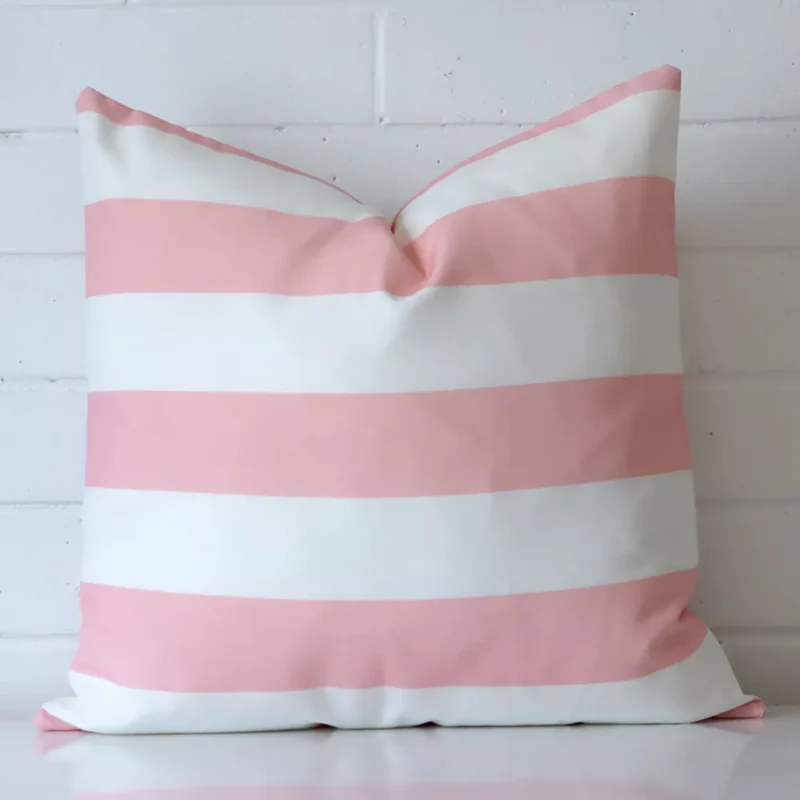 Otama Striped Waterproof Pink Outdoor Cushion Cover – Large SC937-55 Pink cushion cover in front of a white wall. It has a large size and is made from an outdoor material.