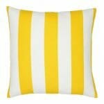 A large outdoor cushion that has a yellow striped pattern and is UV resistant and waterproof.