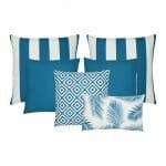 A set of 6 outdoor cushions in teal colours and striped, plain, geometric and botanical designs.