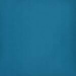 A close up view of waterproof outdoor cushion cover that is teal solid colour on both sides.