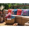 Colourful and bright outdoor cushions in neutral brown sofa