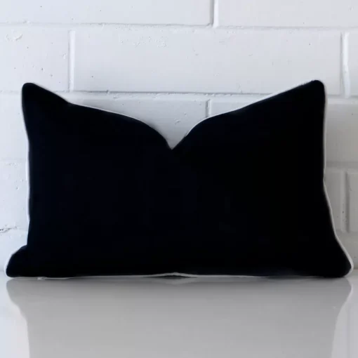 A gorgeous outdoor rectangle cushion in black.