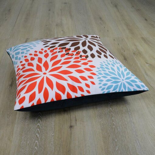 Image of flower inspired red, brown and teal coloured floor cushion