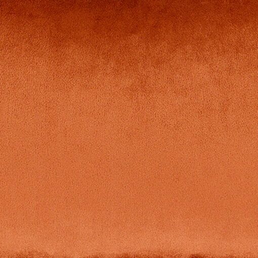 Close up image of rectangular velvet cushion cover in rust orange colour