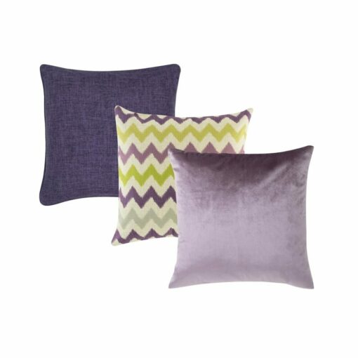 An image of three cushion covers including one purple cushion, a purple and green pattern cushion and a lavender velvet linen cushion.