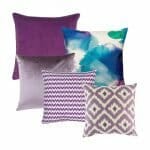 A set of five square cushion covers in purple and lavender colours and patterns.