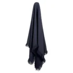 A navy linen throw hanging on a hook.