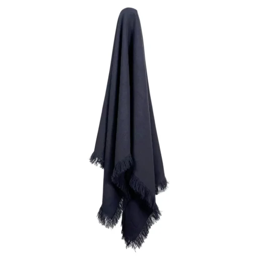 A navy linen throw hanging on a hook.