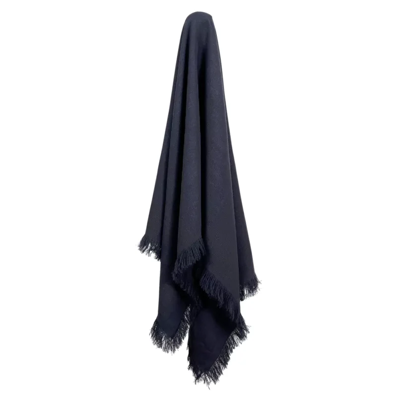 A navy linen throw hanging on a hook.