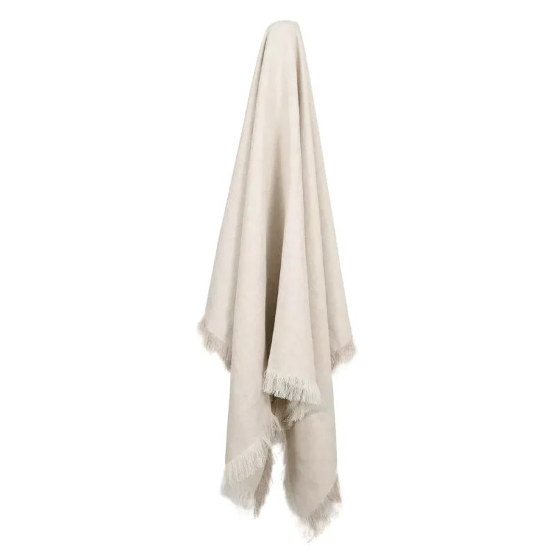 A stone linen throw hangs on a hook.