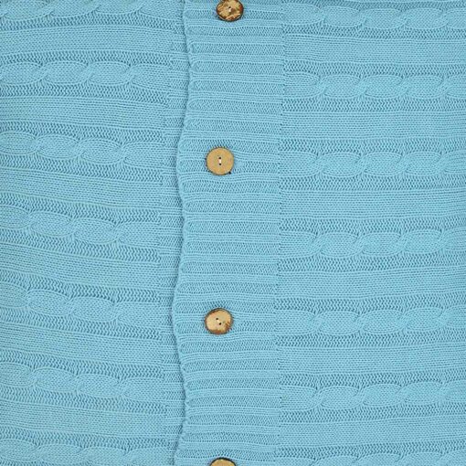 Close up of bright teal cushion cover made of knit fabric