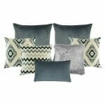Set of seven cushion covers with grey and green colours and patterns.