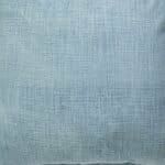 Close up image of denim blue cushion cover made of sand blasted cotton fabric