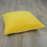 Photo of large sunny yellow floor cushion cover made of rich velvet fabric