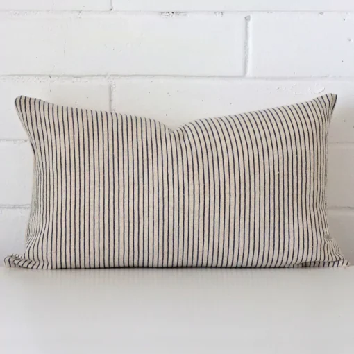 An alluring designer rectangle cushion cover. It features an attractive striped style.