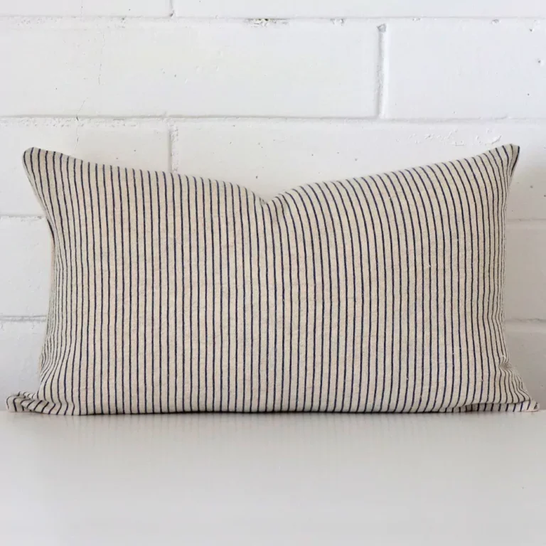 An alluring designer rectangle cushion cover. It features an attractive striped style.