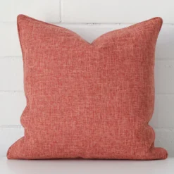 A graceful square auburn cushion made from a durable linen fabric