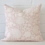 A stunning square linen cushion in a light pink colour. It has an exquisite floral design.