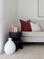 The premium cushions from the set of 5 Ali sofa cushions are nestled in a corner of the sofa.