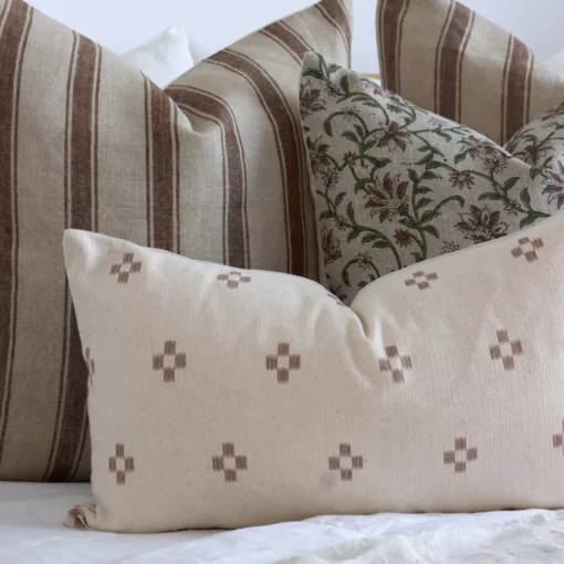 A close up shot of 4 designer cushions magnifying their colours and designs.