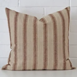 A hero shot of a striped large cushion cover. It is made from a deluxe designer fabric.
