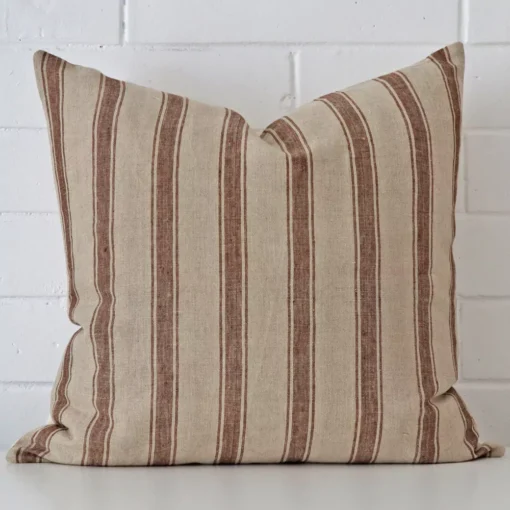 A hero shot of a striped large cushion cover. It is made from a deluxe designer fabric.