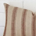 A close up image of this striped rectangle cushion. The image shows details of its designer fabric.