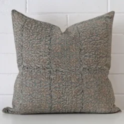 A stunning large designer cushion. It has an exquisite floral design.