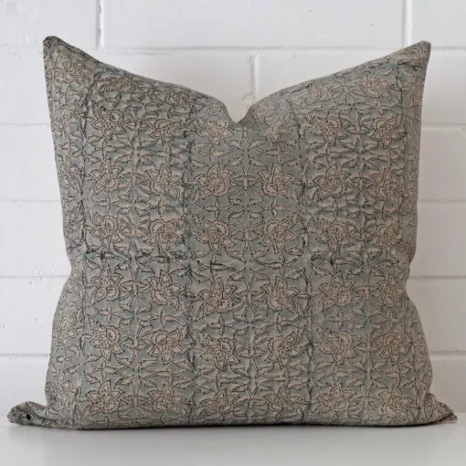 A stunning large designer cushion. It has an exquisite floral design.