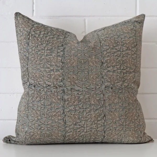 A stunning large designer cushion. It has an exquisite floral design.