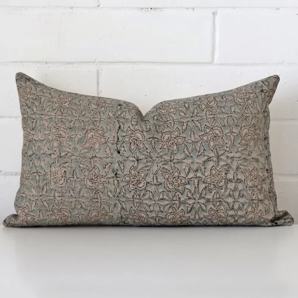 Vibrant floral cushion cover constructed from designer fabric and shown in a rectangle size.