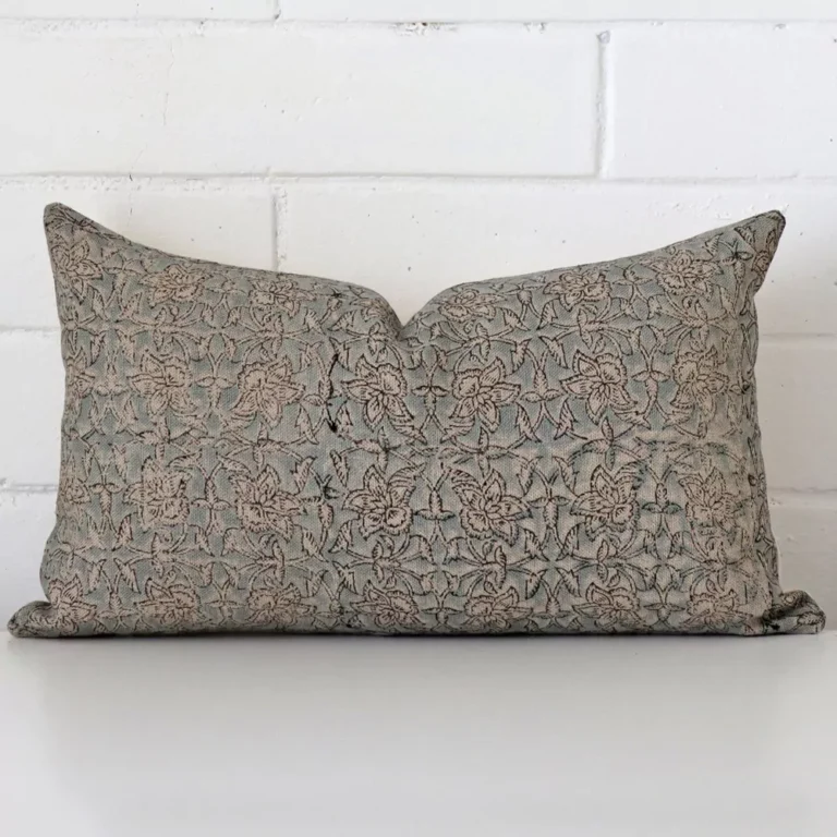 Vibrant floral cushion cover constructed from designer fabric and shown in a rectangle size.