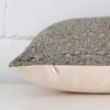 Side angle of floral cushion cover that has designer fabric and a rectangle size.