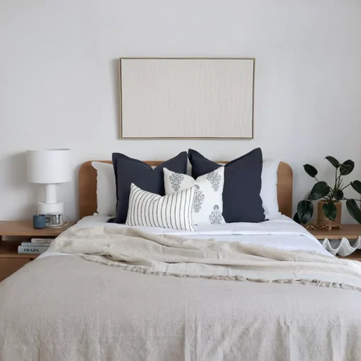 The bedroom gets a cozy touch with a set of four blue-hued cushions from the Amelie bed cushion set.