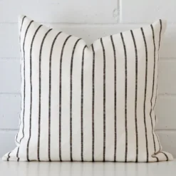 A superior linen cushion cover yielding a striped style and in a classy square size.