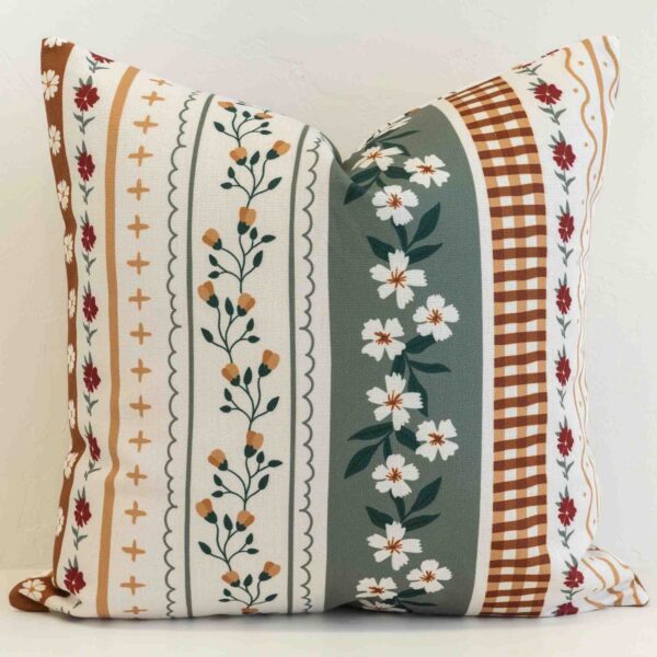 Amora floral stripe cushion with multicolour bands and mixed botanical designs.