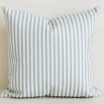 Sage pinstripe cushion cover on cream cotton-linen base.
